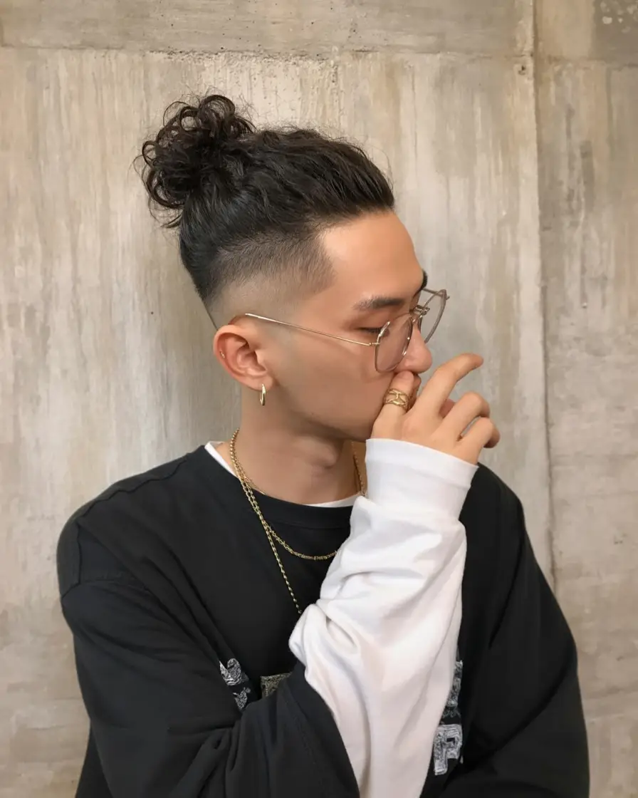 #1. Curly Top Knot with Tapered Fade