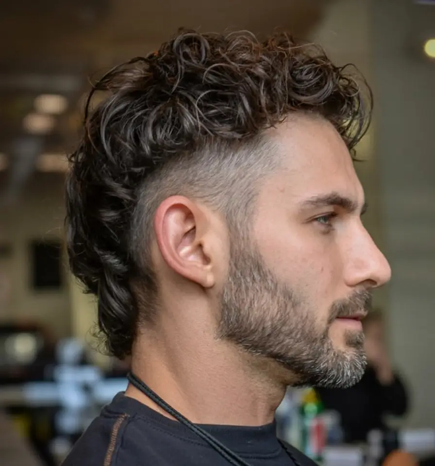 #12. Curly Tapered Mohawk with Low Fade