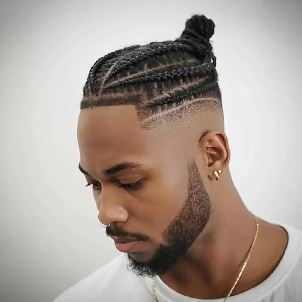 #9. Taper Fade Cornrows with Knotted Top Bun